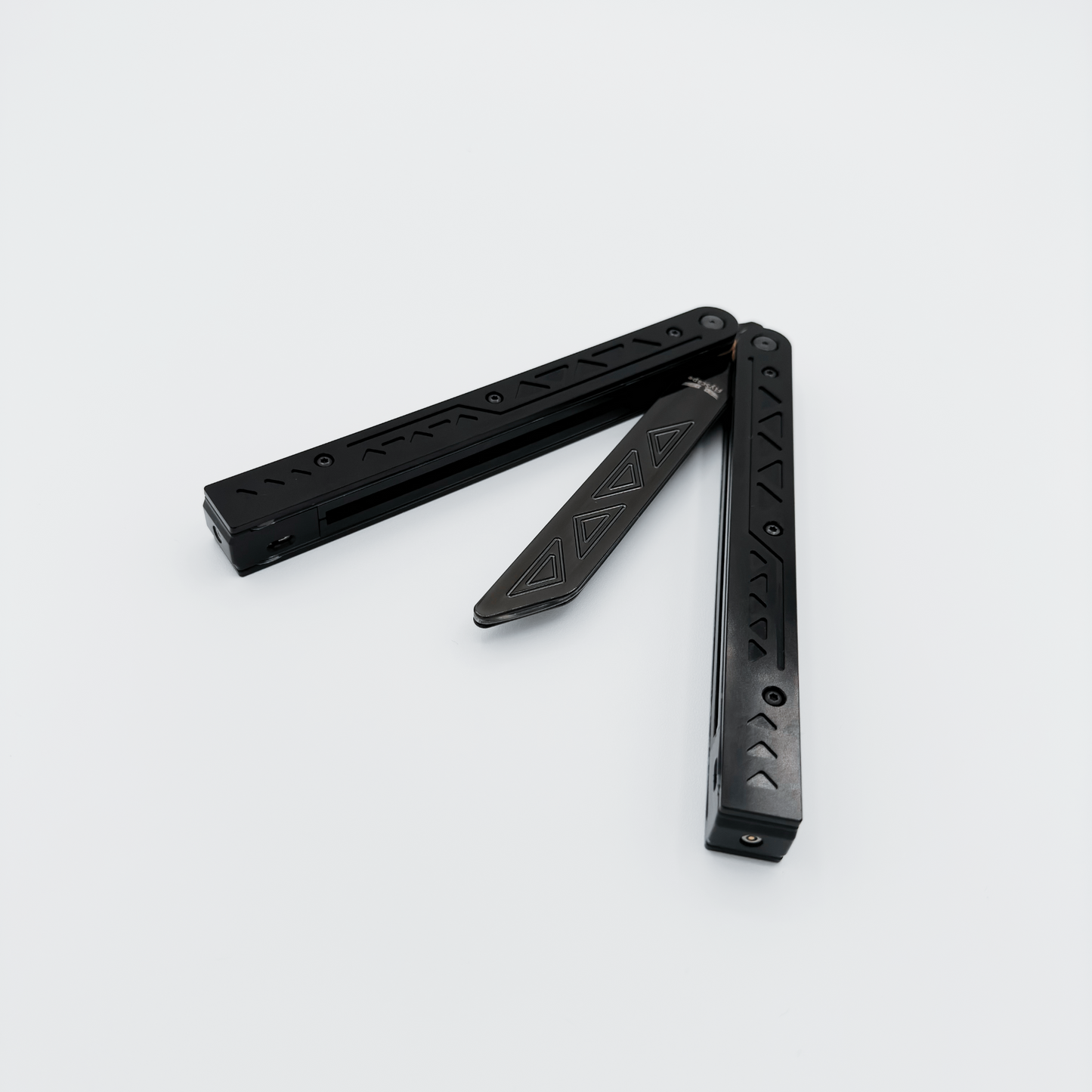 Partially open EOS butterfly trainer in anodized black Aluminum 7075 casing, fiber optics unlit.