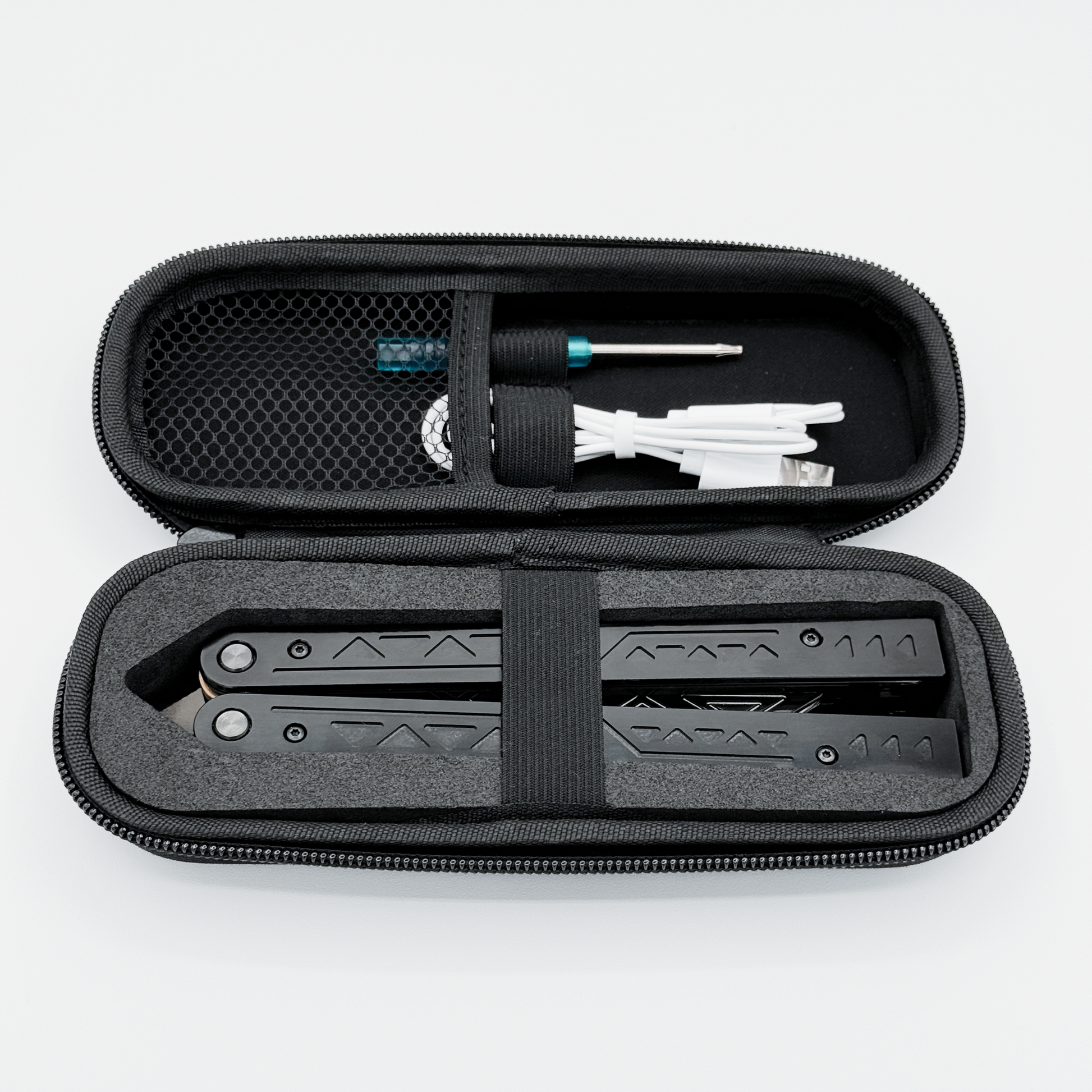 The EOS light-up butterfly trainer in its carrying case, including charging cable and screwdriver.