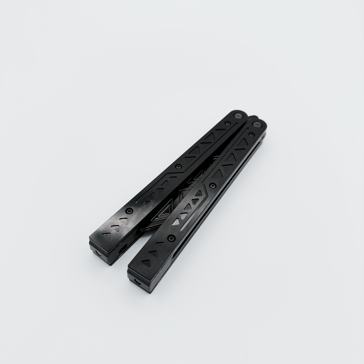 Closed EOS rechargeable balisong with anodized black finish, shown with unlit fiber optic technology.