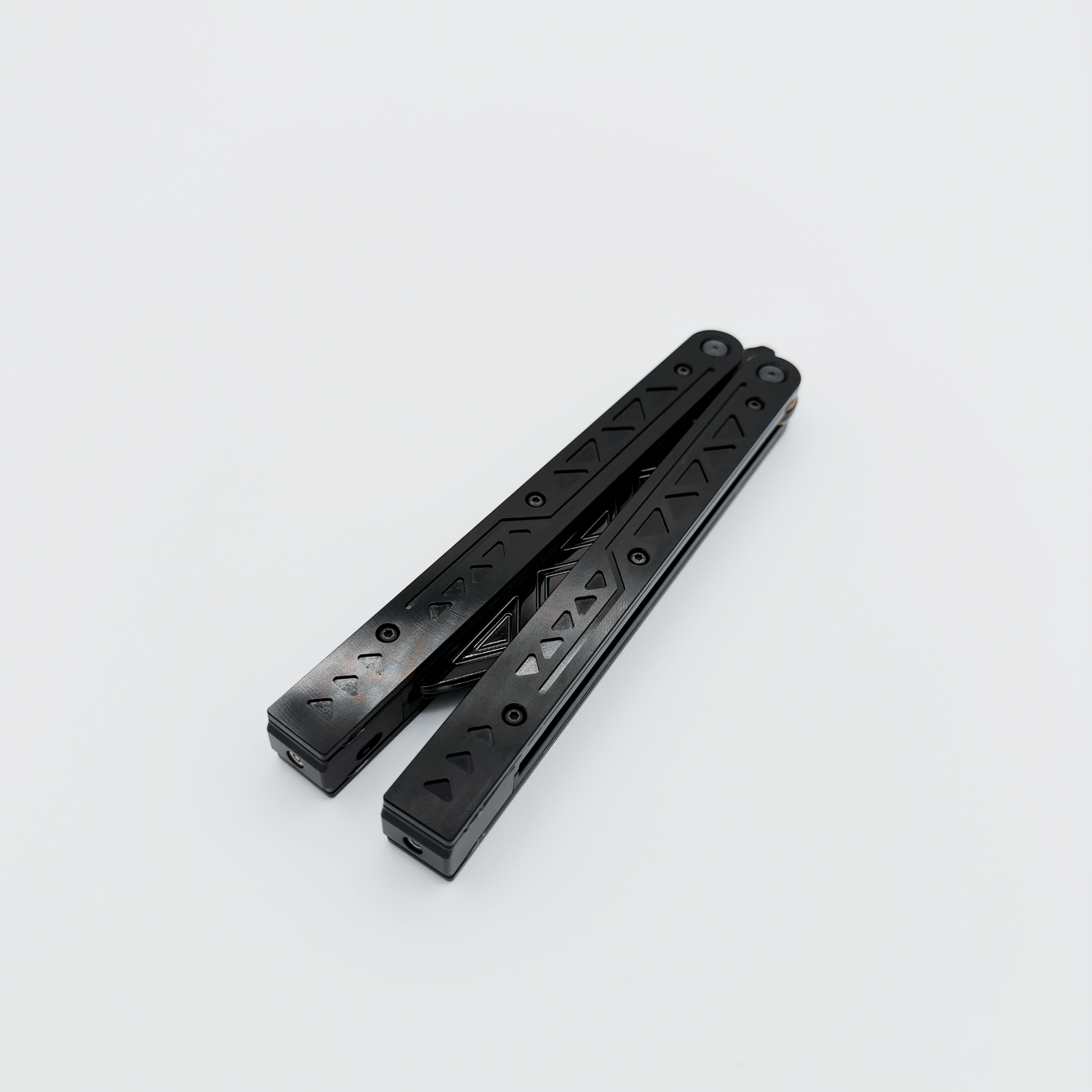 Closed EOS rechargeable balisong with anodized black finish, shown with unlit fiber optic technology.